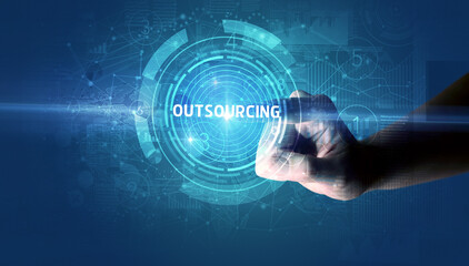 Hand touching OUTSOURCING button, modern business technology concept