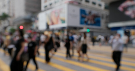 Bokeh of people walk in the street