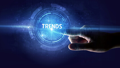 Hand touching TRENDS button, modern business technology concept