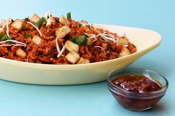 Schezwan paneer fried rice with schezwan sauce,Chinese fried rice with paneer,indo-chinese cuisine dishes. selective focus