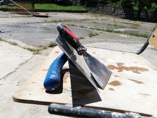 Craftsman plaster tools. Polished trowel,  putty scraper and trowel