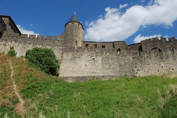 Fototapeta premium Carcassonne castle, Provence, France, side view of the castle from the side of the hill in a sunny day in Provence. Middle age castle UNESCO.