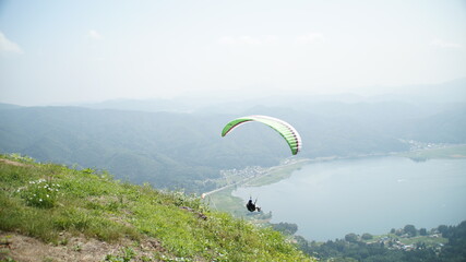 Fly over the lake Kizaki with a paraglider