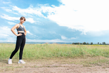 Young woman running in the nature. Free space for text