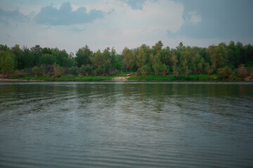 Omsk. Siberian expanses. Beauty Of Russia. irtysh river. There are trees along the river Bank. The surface of the water. View from the shore.