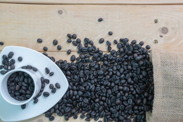 Black coffee in white cup and coffee beans