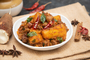 Popular traditional South Indian food  Kappa or tapioca biryani hot and spicy dish made with cooked organic cassava root, grated coconut, beef or steak and Kerala, India. staple food Brazil.