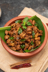 Beef fry curry roast mutton curry meat dish Kerala, India. Hot and spicy homemade side dish of Kappa biryani , Appam, Parotta, Puttu. South Indian non veg food