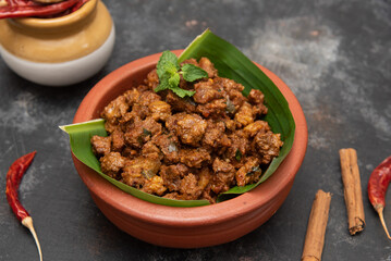 Beef fry curry roast mutton curry meat dish Kerala, India. Hot and spicy homemade side dish of Kappa biryani , Appam, Parotta, Puttu. South Indian non veg food