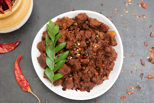 Beef fry curry roast mutton curry meat dish Kerala, India. Hot and spicy homemade side dish of Kappa biryani , Appam, Parotta, Puttu. South Indian non veg food
