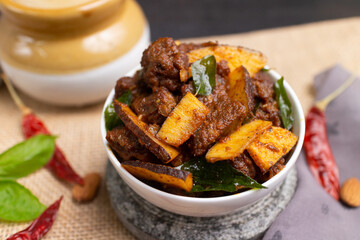 Beef fry curry roast mutton curry meat dish Kerala, India. Hot and spicy homemade side dish of Kappa biryani , Appam, Parotta, Puttu. South Indian non veg food