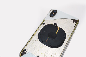Shanghai , China -  July 09, 2020: Damaged Dual Camera iPhone in front of White background. The...