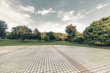 Outdoor park square's brick walkway at sunrise and sunset.