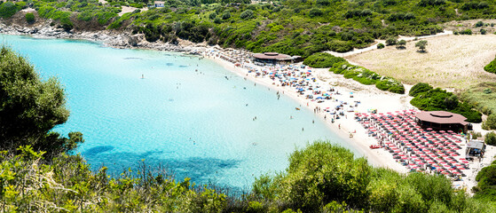 Sardinia and Mediterranean Sea. Italy. Cala Monte Turno Beach with Tourists.