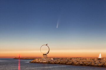July, 9, 2020: C/2020 F3 Neowise comet over the pier of San Benedetto del Tronto , a touristic city on the Adriatic coast