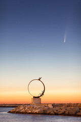 July, 9, 2020: C/2020 F3 Neowise comet over the pier of San Benedetto del Tronto , a touristic city...