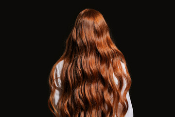 Fototapeta premium Beautiful young redhead woman on dark background