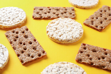 Healthy crispbreads on color background