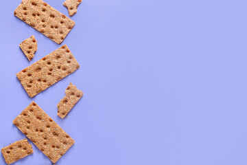 Rye crispbreads on color background