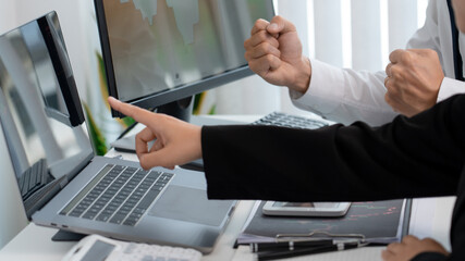 Business team investment trading Analysing data, graphs and reports working on Laptop Stock market...