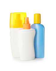 Bottles of sunscreen on white background