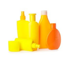 Bottles of sunscreen on white background