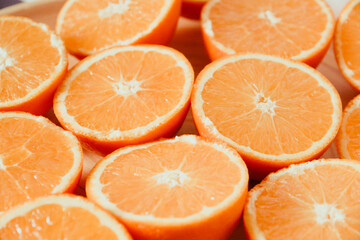 Bunch of fresh sliced oranges on a tray