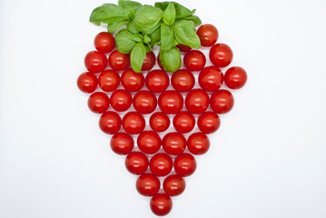 strawberry shaped tomatoes with basilicum on top