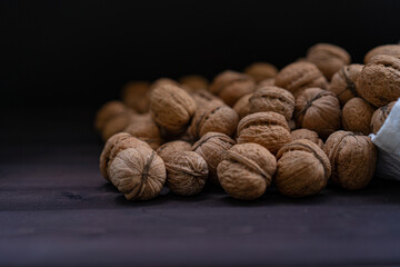 Ripe walnuts on a wooden background