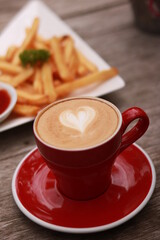 coffe latte cup on a wood table.
