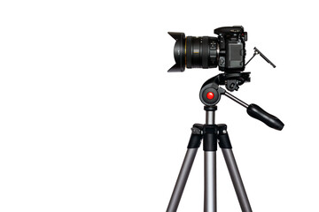 Digital camera with lens hood on tripod isolated on white background with copy space	