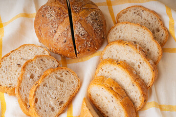 Group of many type of bread on a plate and cooking flour.