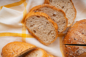 Group of many type of bread on a plate and cooking flour.