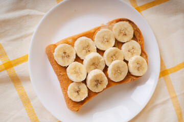 Top view - Home made organic sliced bread with banana on top.