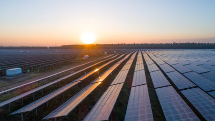 Photovoltaic solar panels at sunrise and sunset.