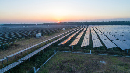 Fototapeta premium Photovoltaic solar panels at sunrise and sunset.