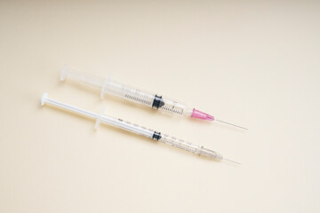 Top view - Two Syringe tubes isolate over white background.