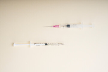 Top view - Two Syringe tubes isolate over white background.