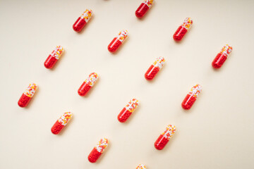 Red pill capsules and molecules as medical concept.