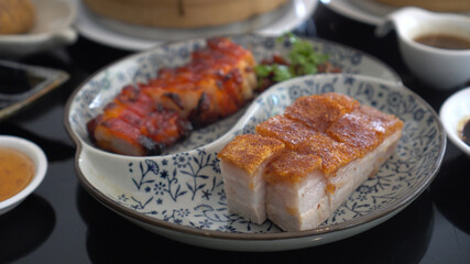 Chopsticks honey barbecue pork crispy Hong Kong Cantonese traditional cuisine