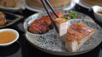 Chopsticks honey barbecue pork crispy Hong Kong Cantonese traditional cuisine