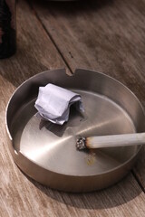 cigarettes burned in an ashtray during the day