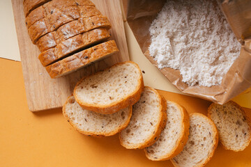 Group of many type of bread on a plate and cooking flour.
