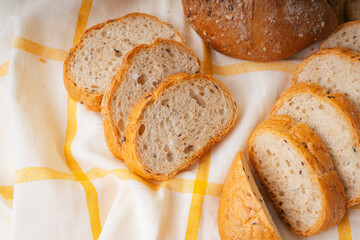 Group of many type of bread on a plate and cooking flour.