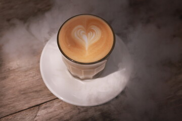 coffe latte cup on a wood table.