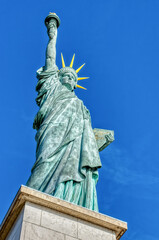Fototapeta premium Famous Statue de la liberte on a bright day of February - Paris, France. This statue was given in 1889 to France by U.S. citizens living in Paris.