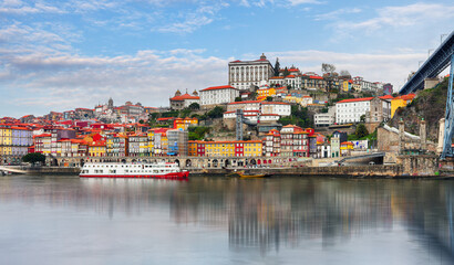 Fototapeta na wymiar Porto at day with reflection in Douro river. Portugal