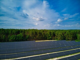 Beautiful view of the solar station on the field. Renewable green energy of the sun.