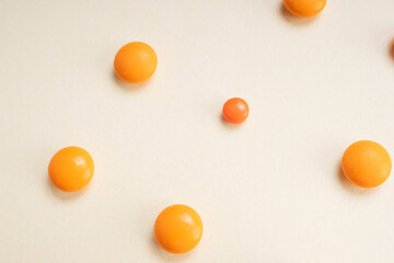 Medicine orange pills circle shape isolate over white background.
