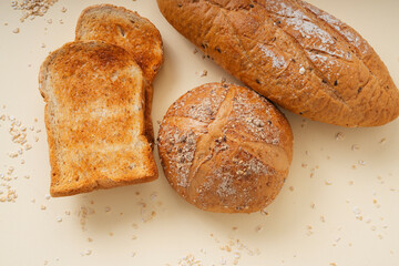 Group of many type of bread on a plate.